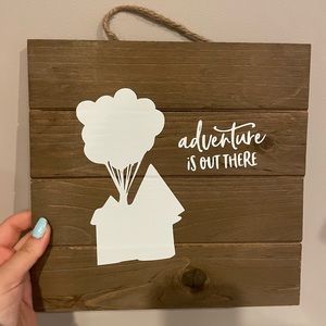 Cute home sign "adventure is out there" from the Disney movie Up!